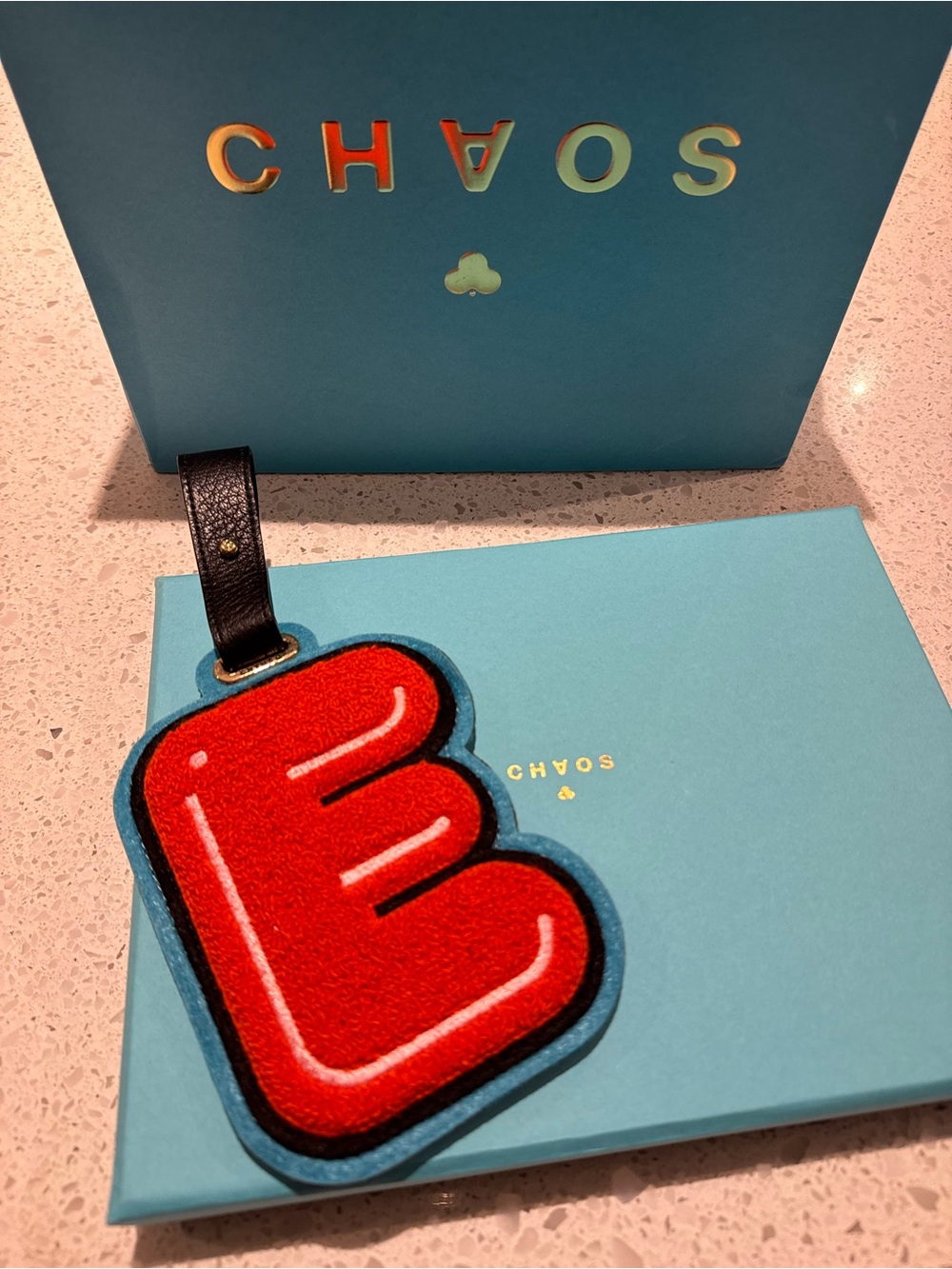 Chaos Orange Letter E Bag Charm with Black Strap